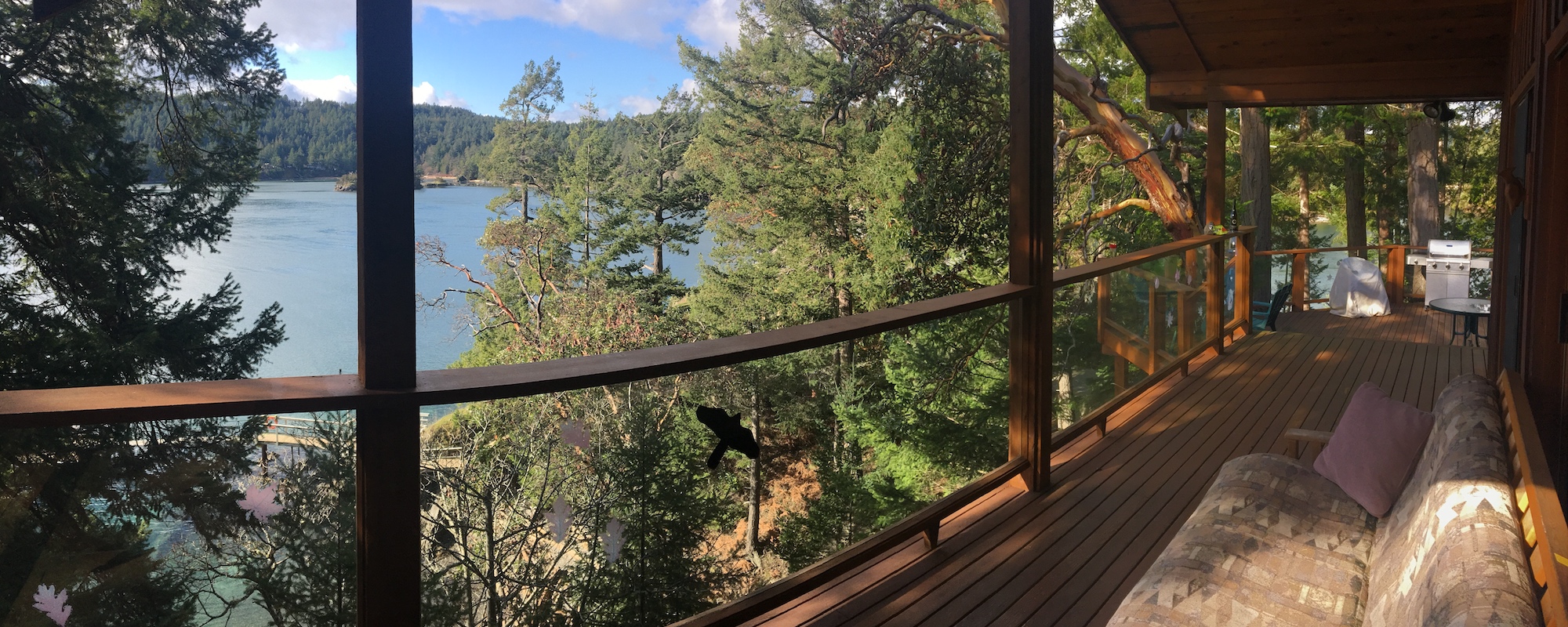Ainslie Point Cottage vacation rental with ocean views from deck on Pender Island